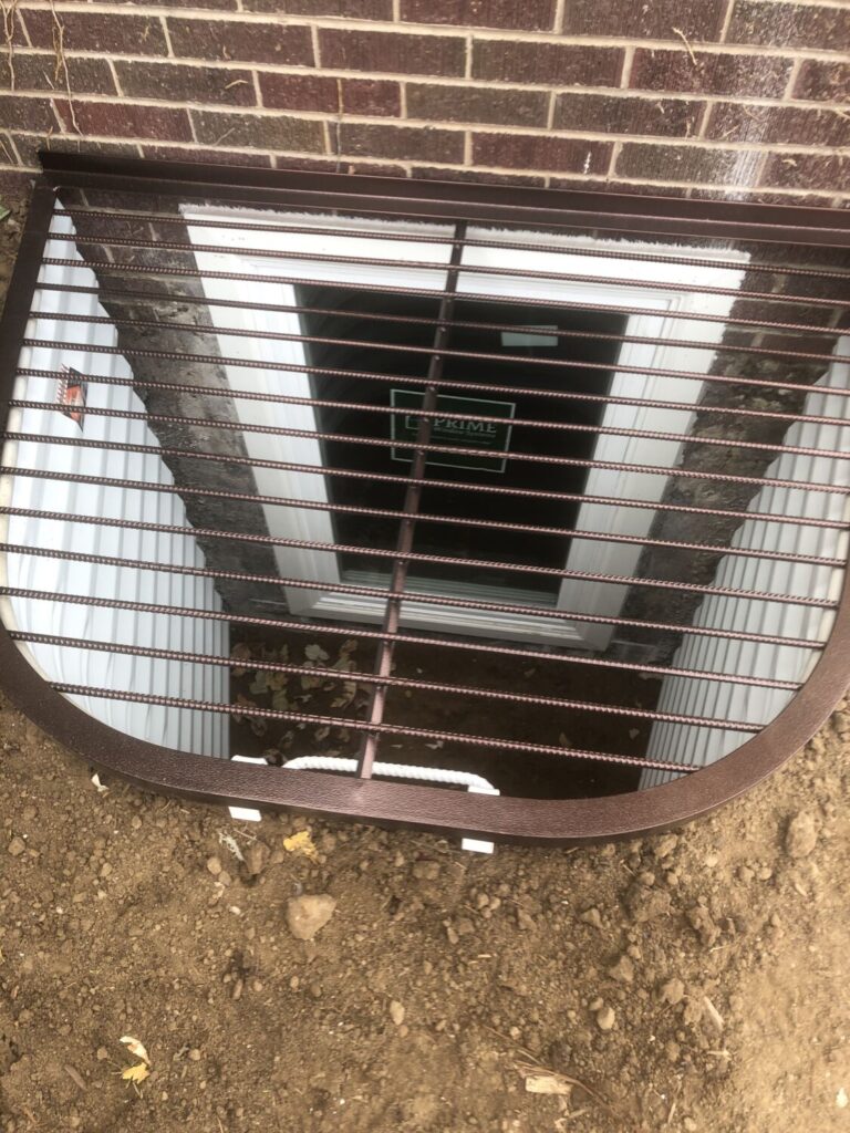 Egress Window well with metal grate cover